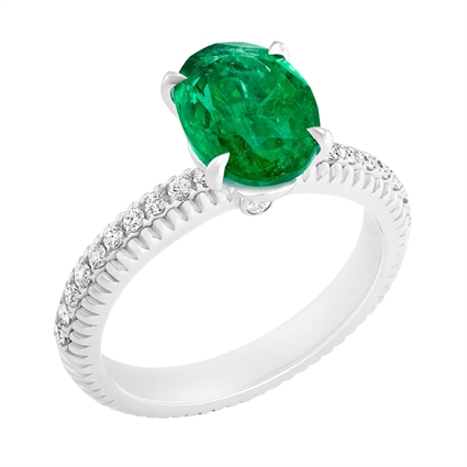 Fabergé Emerald White Gold Fluted Ring features an oval Zambian emerald centre stone, with pavé-set white diamonds, set in 18 karat fluted white gold. 