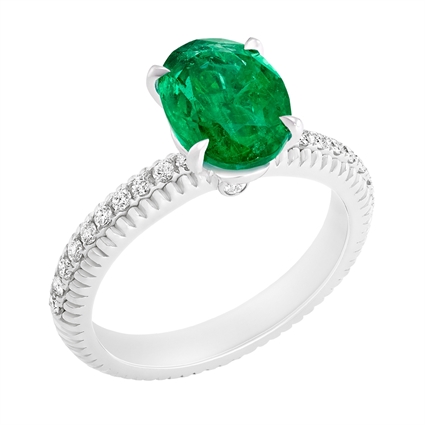 Fabergé Emerald White Gold Fluted Ring features an oval Zambian emerald centre stone, with pavé-set white diamonds, set in 18 karat fluted white gold. 