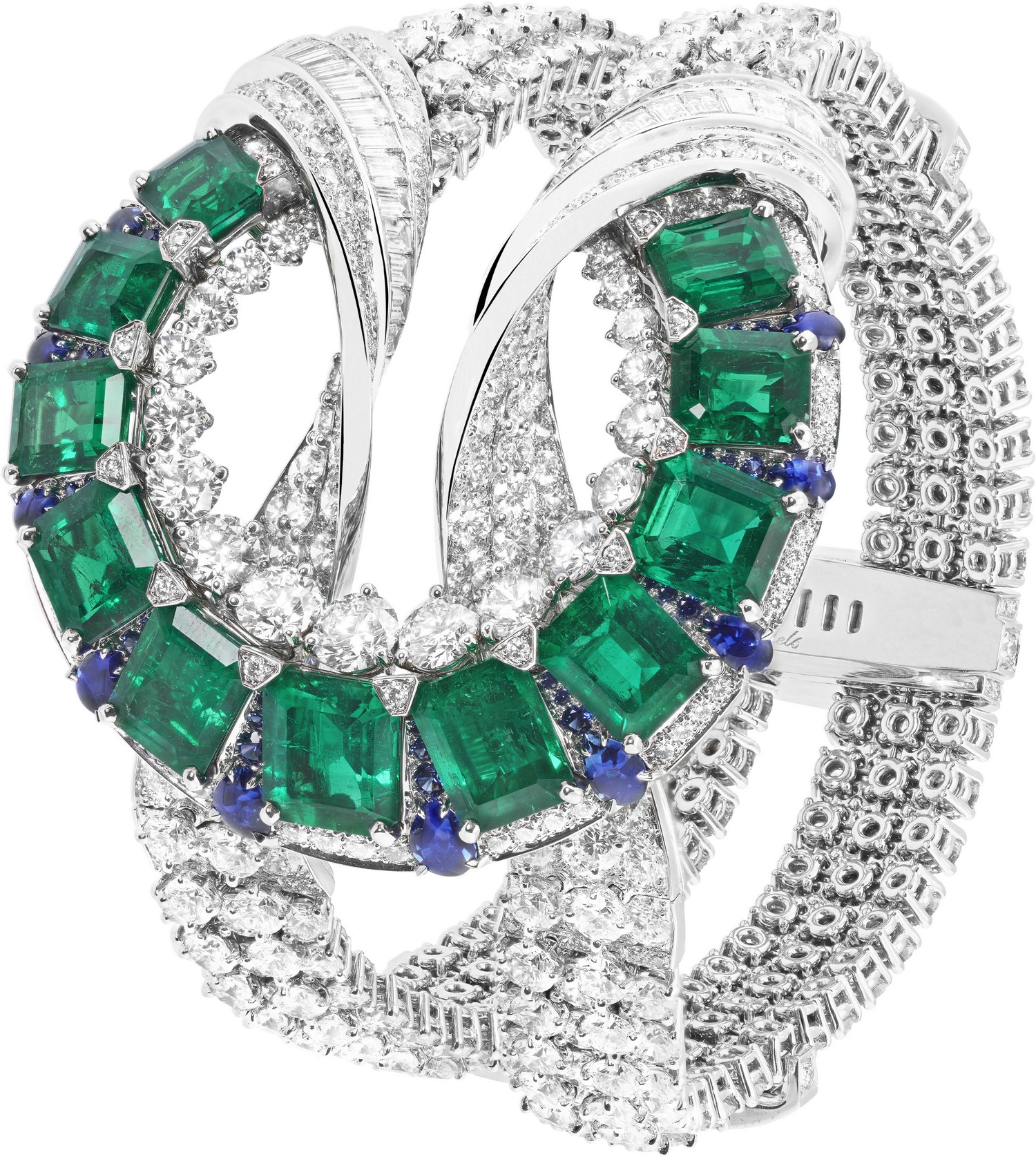 White gold, round and baguette-cut diamonds, round and buff-topped pear-shaped sapphires, 11 octagonal-cut emeralds for a total of 19.38 carats (Colombia).