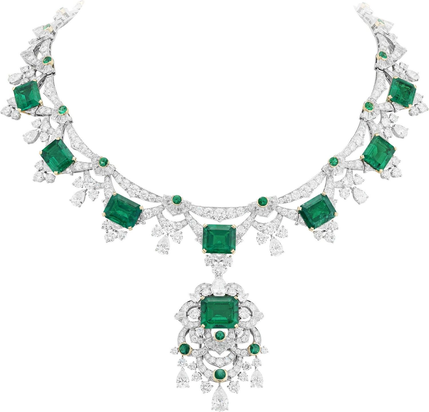 White gold, yellow gold, round, tapered-cut, triangle-cut, baguette-cut and pear-shaped diamonds, buff-topped round emeralds, 9 emerald-cut emeralds for a total of 42.07 carats (Colombia). Detachable clip. 