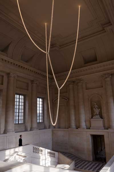 The 12 metre chandelier designed by Ronan and Erwan Bouroullec with Swarovski inside the Versailles.