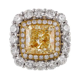 Diacolor, ring featuring 5.05 carats of natural yellow diamond solitaire and white diamonds 