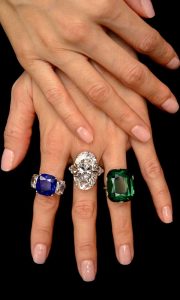 From left, the ‘Star of Kashmir' sapphire ring, a diamond ring by Graff and a ring set with a cushion-shaped 23.28 carats Colombian emerald of exceptional size and quality  