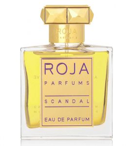 Scandal Eau de Parfum by Roja is presented in a sophisticated French-made glass bottle, finished with a distinctive crystal-embellished gold cap.