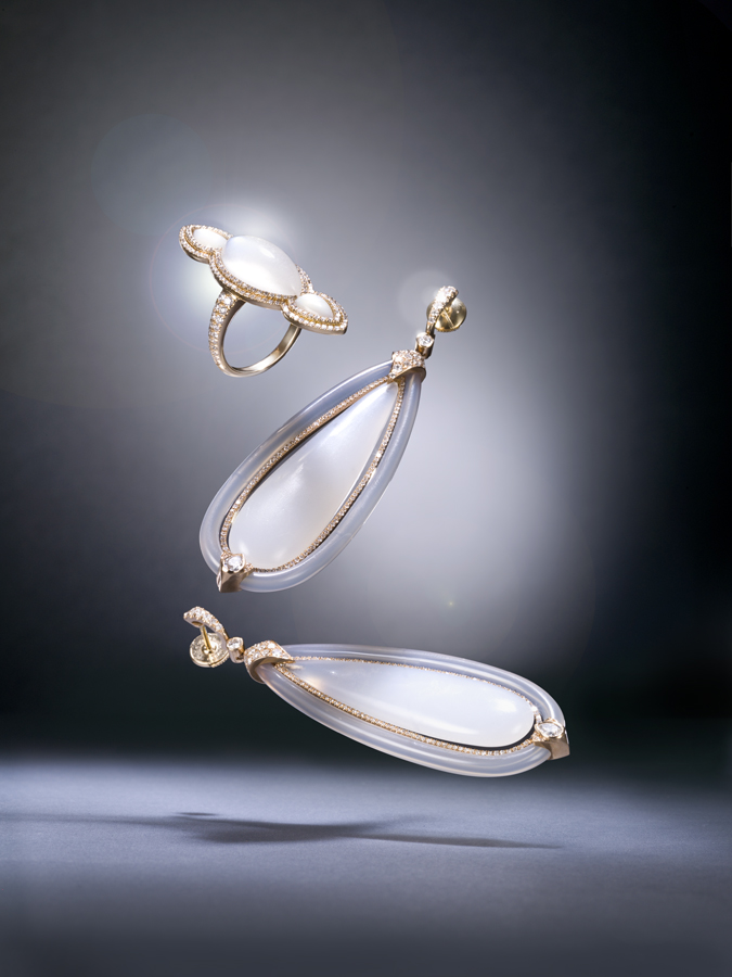 The sheer gracefulness of Inbar. Ring, center stone: marquise moonstone with two mother of pearls with pink gold and diamond setting. Earrings, center stone: chalcedony surrounded with agate band with pink gold and diamond setting.