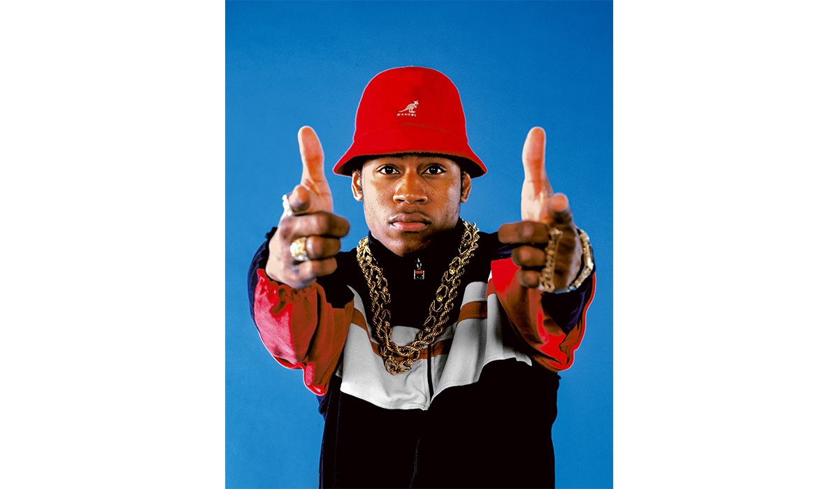 LL Cool J wearing four-finger rings and dookie chains alongside some of the most iconic stylings in hip-hop history. Nameplate ring spelling “James,” his first name, double-layered gold rope chains, and Gruen gold nugget watch. Copyright: Janette Beckman