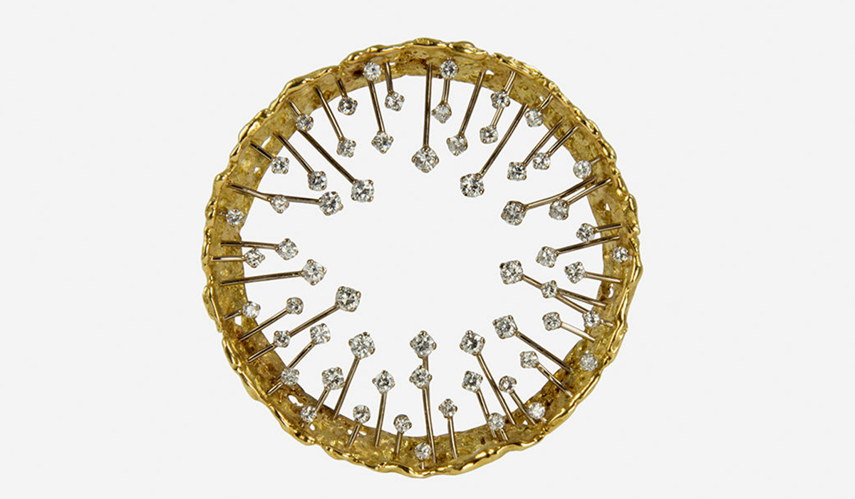 A diamond and 18k nugget flake gold crown design brooch by John Donald, 1972