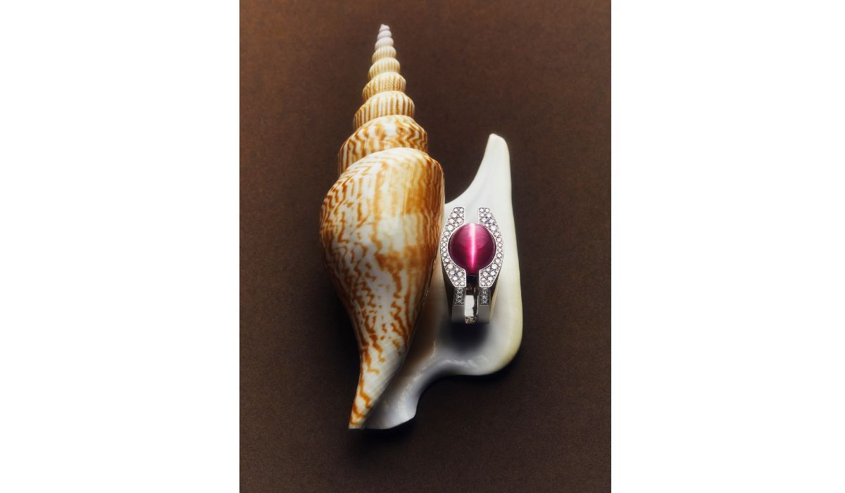 Page. White gold and diamond Semicupola ring featuring a pink tourmaline cabochon with a captivating “cat’s eye” effect,  Riccardo Vitale.