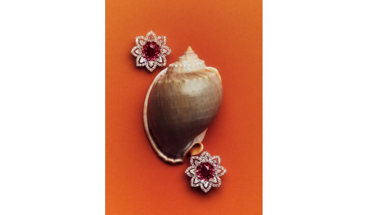 White gold and diamond Eden earrings, set with two central oval-cut Burmese rubies and pear-cut rubies, Busatti Milano.