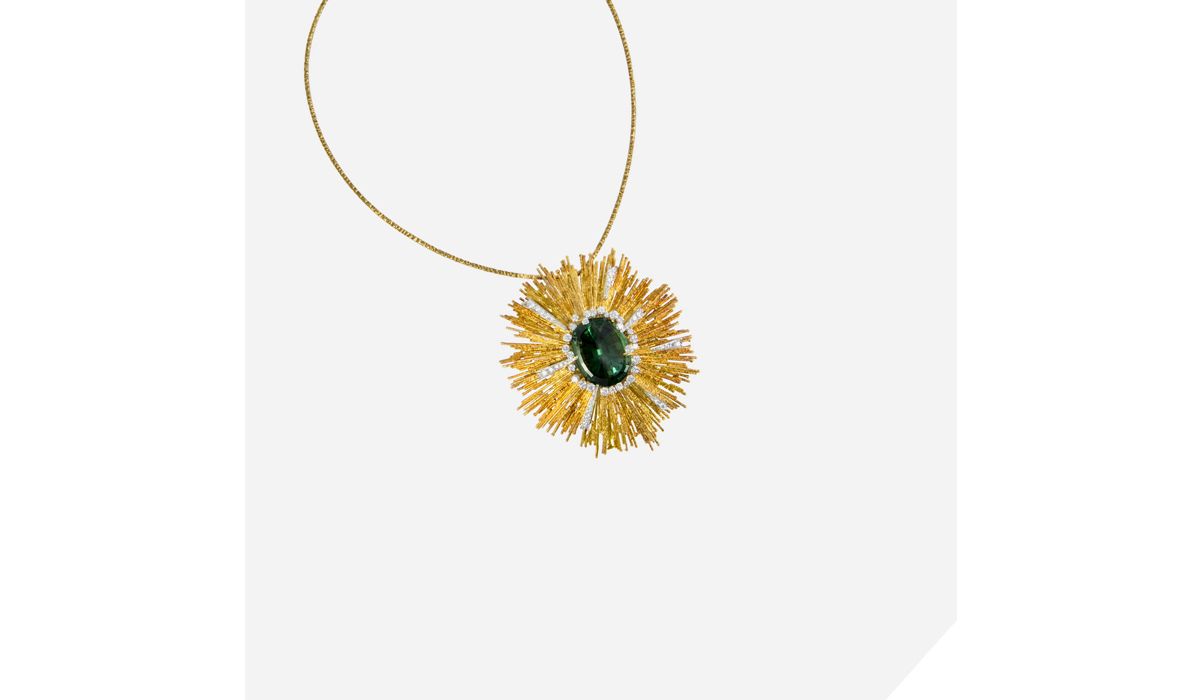 A faceted green tourmaline, diamond and textured 18 karat gold  pendant, on an 18 karat gold torque, by Andrew Grima, 1972