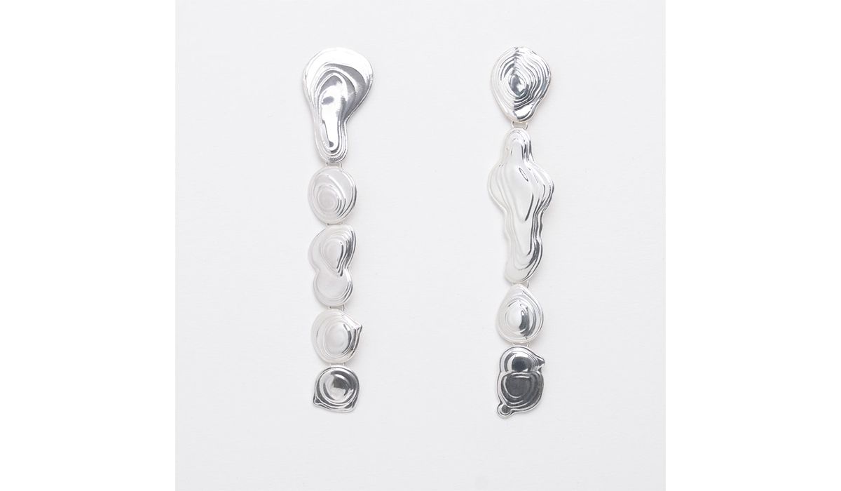 Sterling silver drip earrings. Like a string of silvery water droplets. Leigh Miller