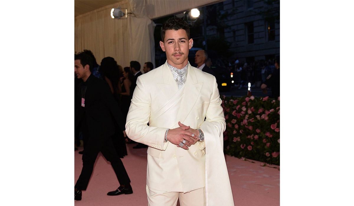 Nick Jonas wearing Chopard jewelry