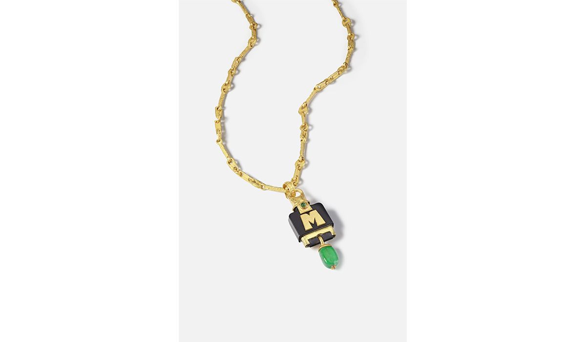 Gold Memento necklace with charging plug pendant with 'M' initial in gold, and tumbled emerald