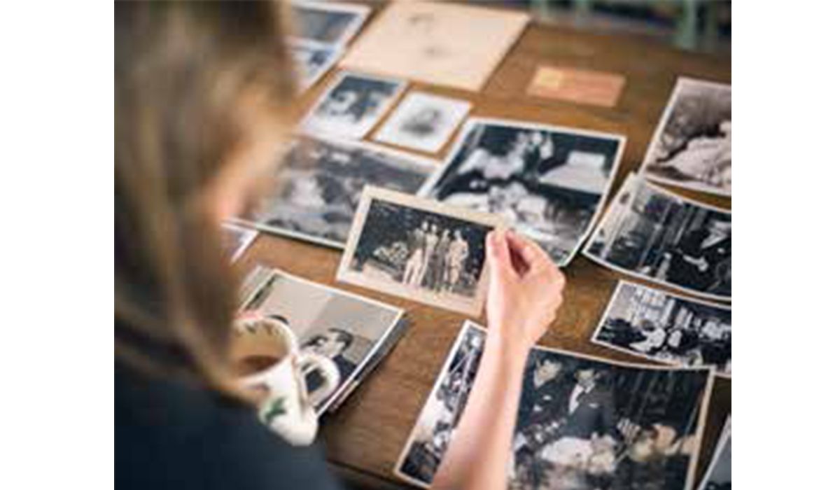 Francesca Cartier Brickell looking at family photos