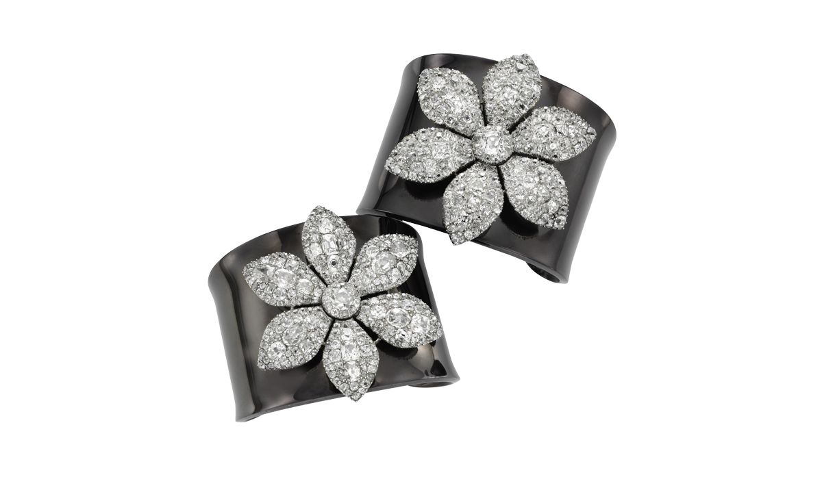 a pair of georgian diamond flower brooches on detachable blackened silver cuffs, 1770 ca