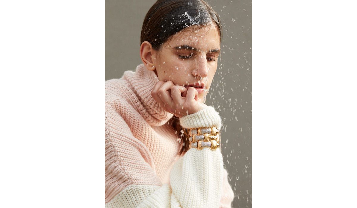 Hammered gold and diamond Paglia cuff, Vendorafa. Sweater, Valentine Witmeur Lab.