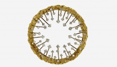 A diamond and 18k nugget flake gold crown design brooch by John Donald, 1972